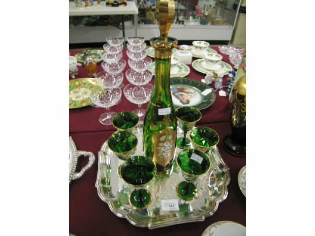 Appraisal: Emerald Art Glass Decanter with six cordials enameled floral gold