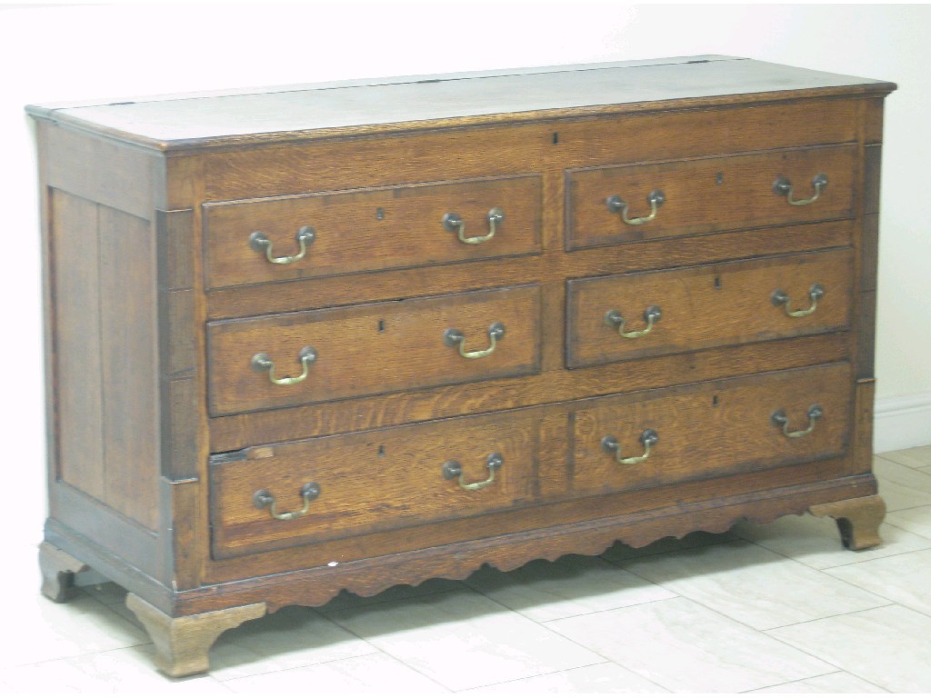 Appraisal: An oak Lancashire Chest of three drawers flanked by corner