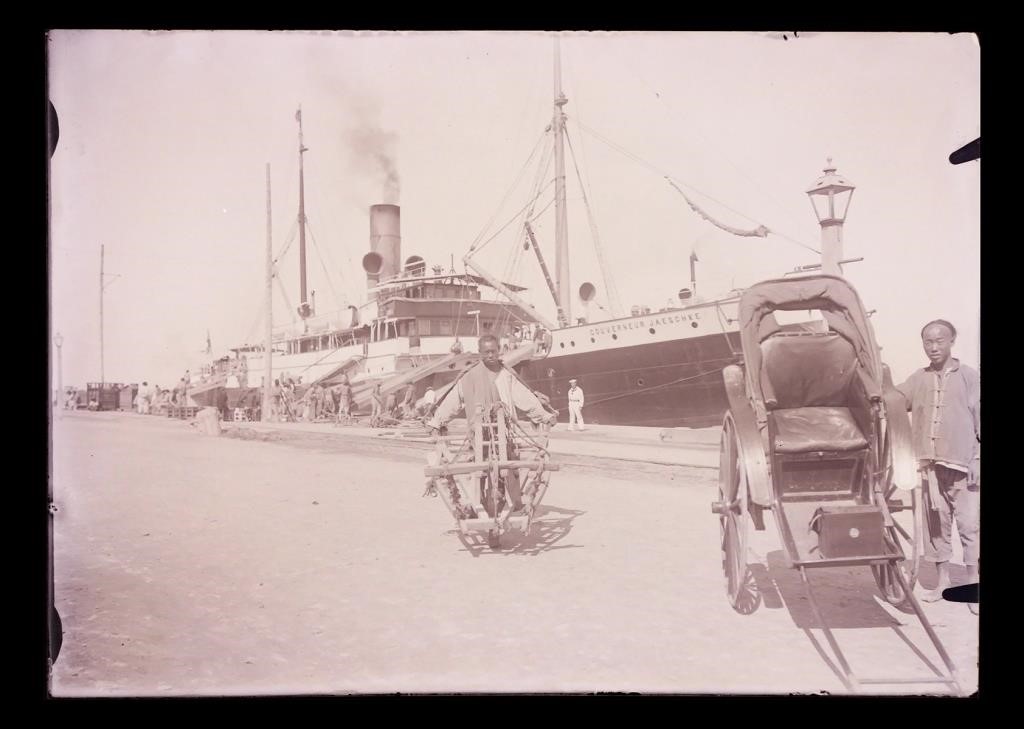 Appraisal: Circa glass negative of a rikshaw and Chinese dock workers