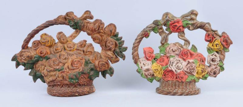 Appraisal: Lot Of Cast Iron Roses in Basket Doorstops One by