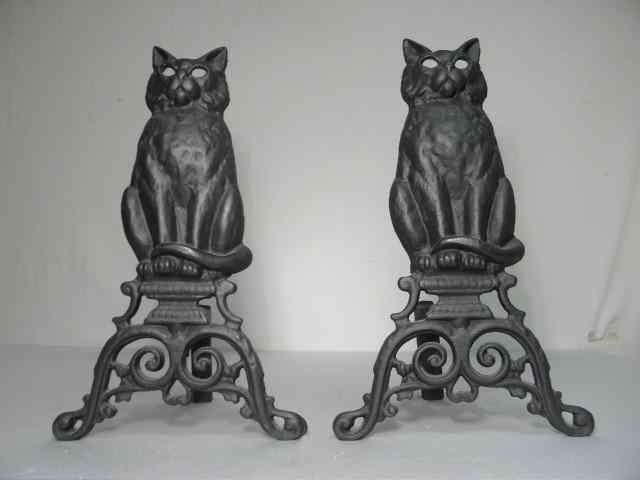 Appraisal: Pair of black cast iron figural andirons Each depicts a