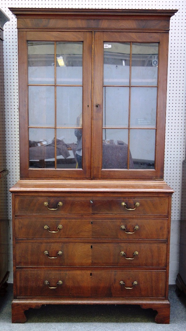 Appraisal: A George III mahogany bookcase chest the pair of glazed