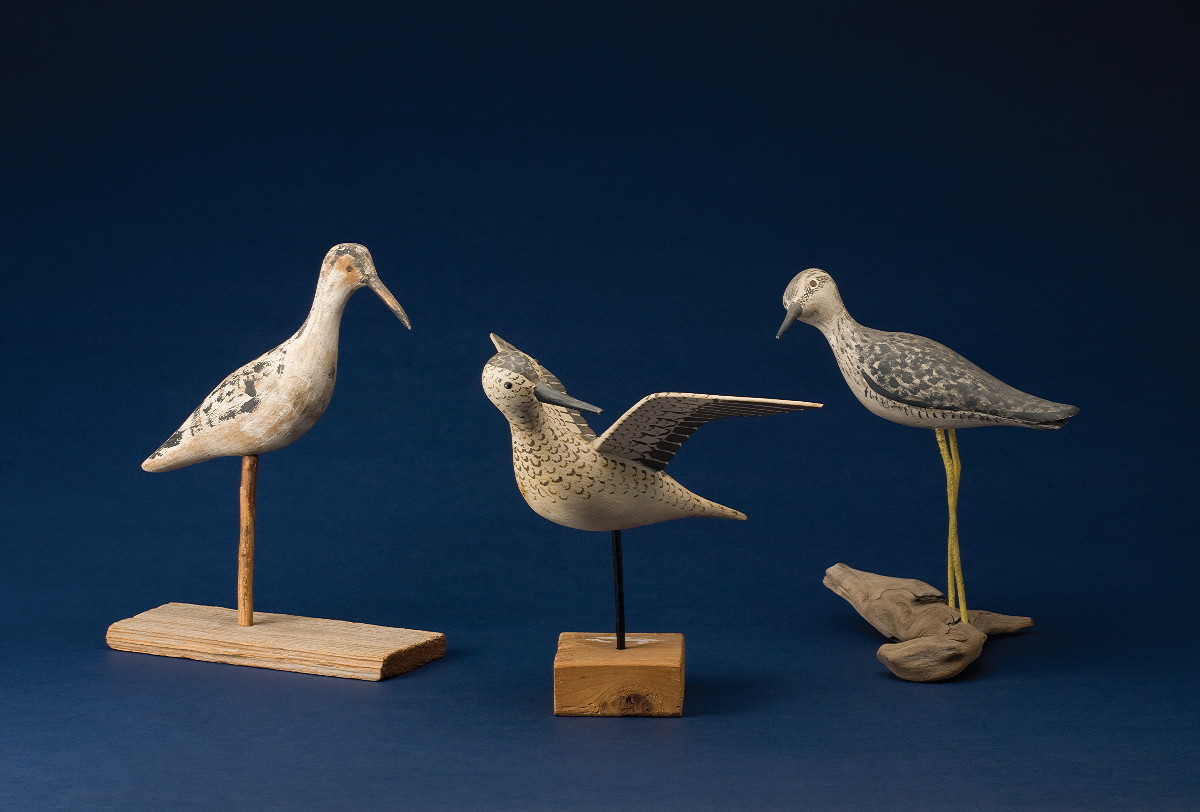 Appraisal: THREE CARVED AND PAINTED SHOREBIRDS Including a Yellowlegs with outstretched