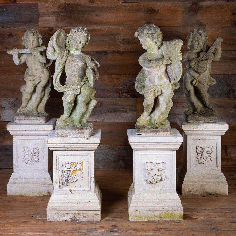 Appraisal: Set of Four Cherub Form Cast Stone Musicians on Matching