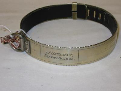 Appraisal: A WHITE METAL DOG COLLAR with padlock and leather interior