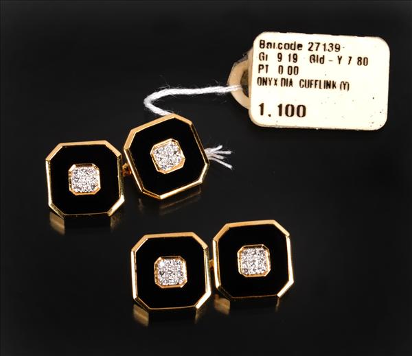 Appraisal: A pair of onyx and diamond double sided cufflinks the