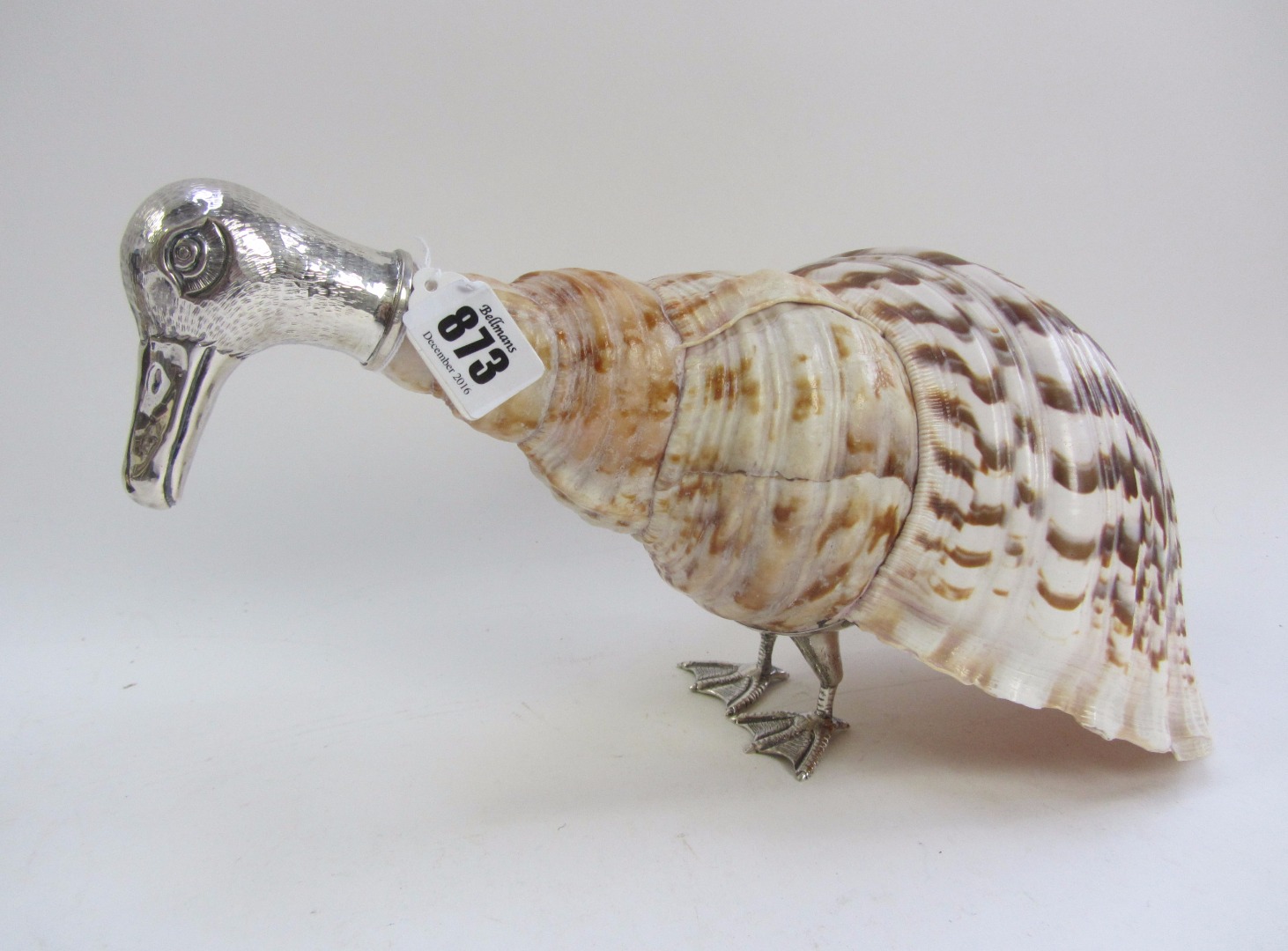 Appraisal: A white metal mounted nautilus shell depicting a duck cm