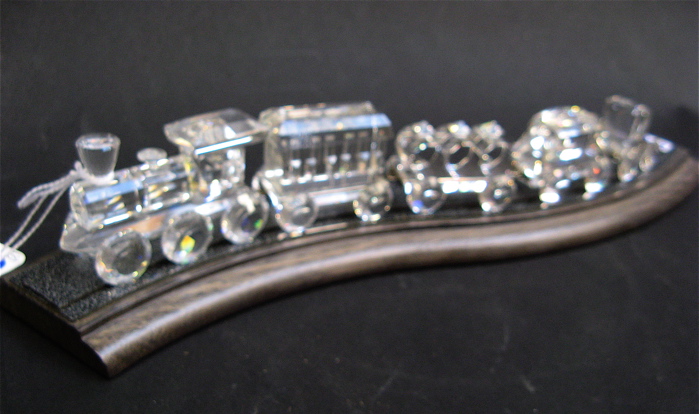 Appraisal: SWAROVSKI AUSTRIAN CUT CRYSTAL TRAIN SET AND A ROCKING HORSE