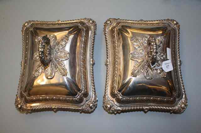 Appraisal: A PAIR OF SILVER PLATED TUREENS AND COVERS decorated with