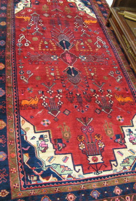 Appraisal: PERSIAN TRIBAL CARPET overall stylized flower and animal motif on