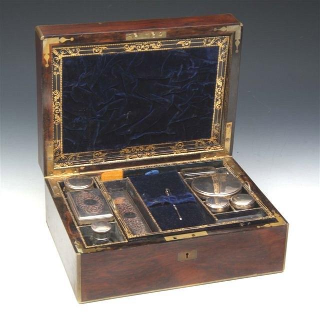 Appraisal: A REGENCY ROSEWOOD AND BRASS BOUND GENTLEMAN'S DRESSING CASE by