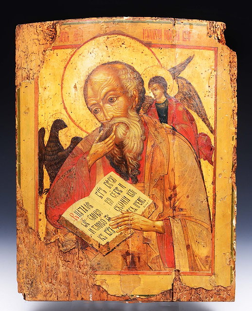 Appraisal: AN EARLY ORTHODOX ICON depicting St John The Evangelist holding