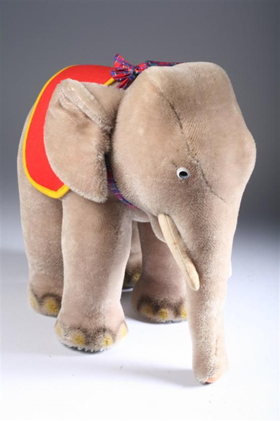 Appraisal: STEIFF MOHAIR ELEPHANT Chest tag With felt tusks Wearing red