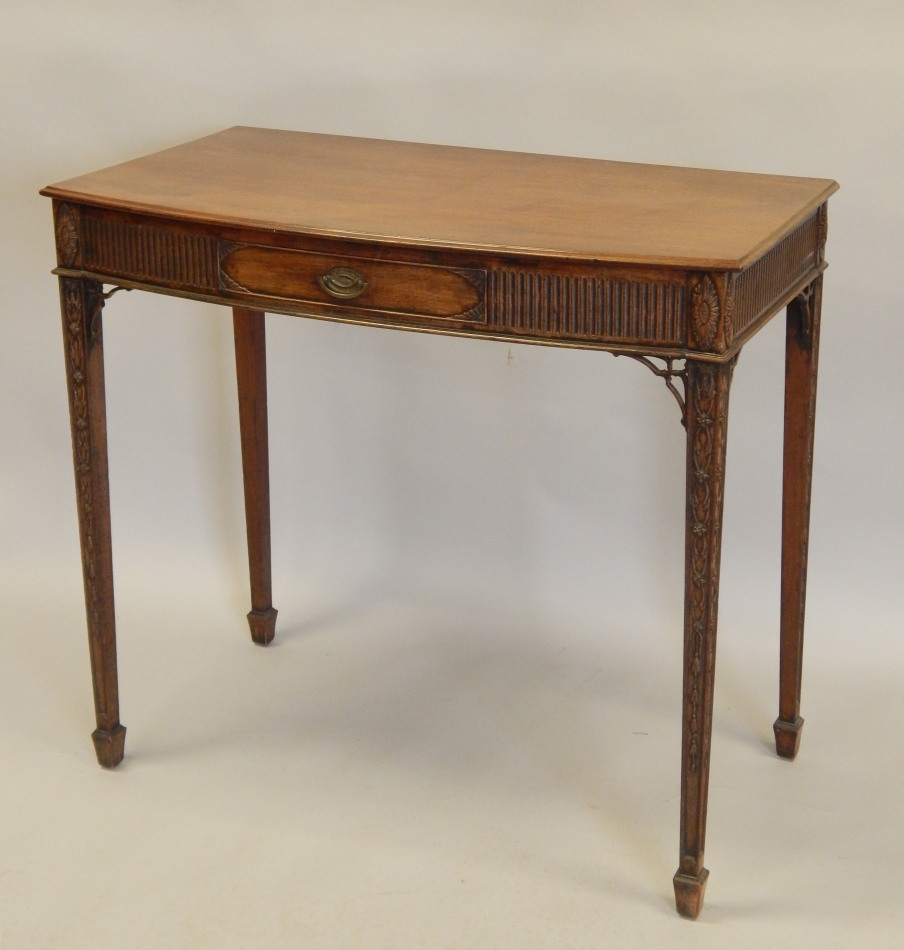 Appraisal: A thC mahogany small serving table the bow fronted top