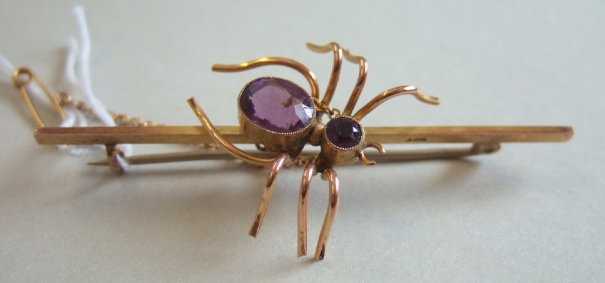 Appraisal: A gold and amethyst set two stone bar brooch with