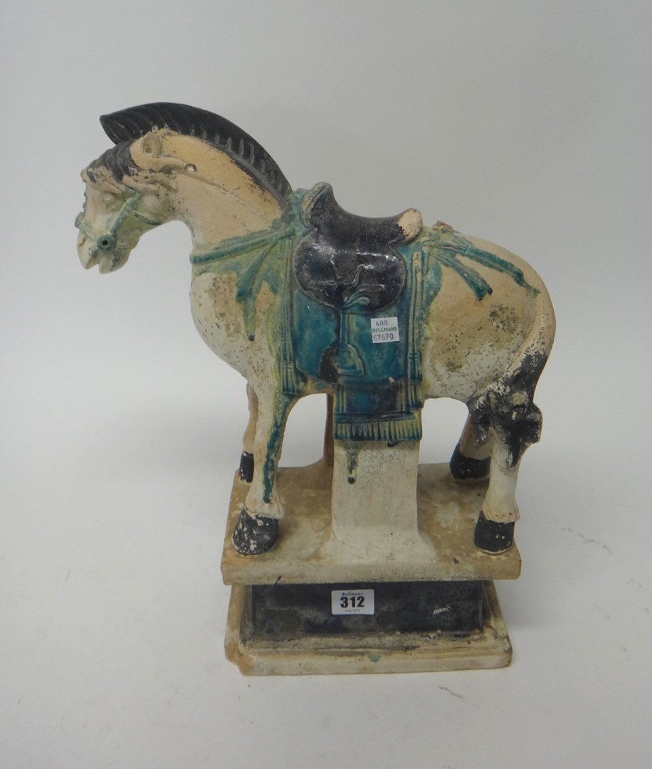 Appraisal: A Chinese painted pottery horse probably Ming dynasty standing four