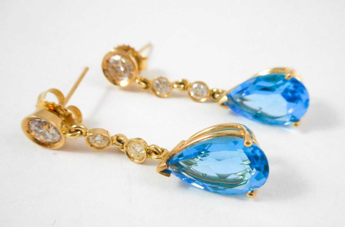 Appraisal: PAIR OF BLUE TOPAZ AND DIAMOND EARRINGS each k yellow