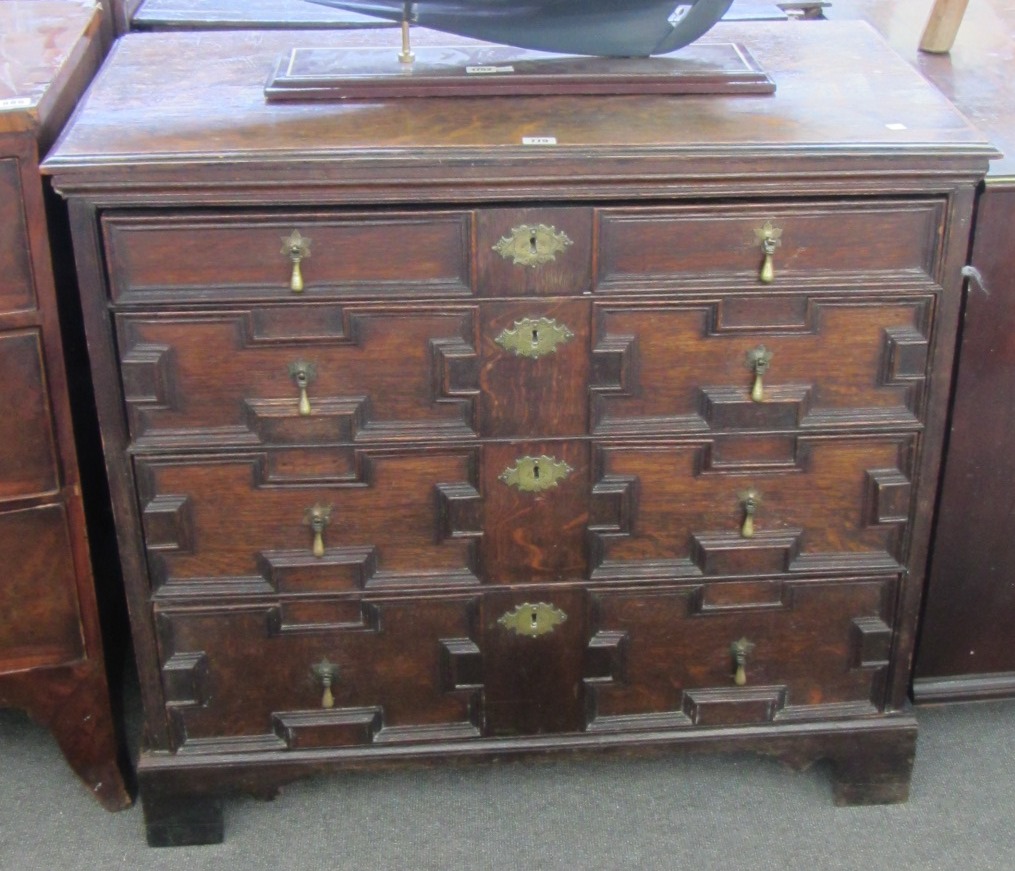 Appraisal: A Charles II and later oak chest of four long