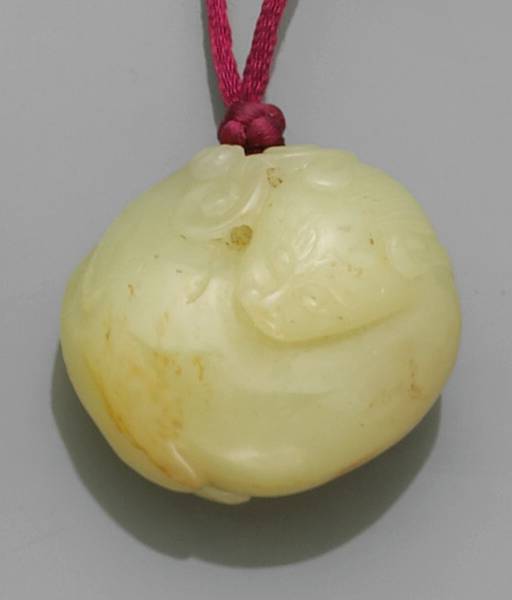 Appraisal: A yellow jade toggle Worked in the form of a