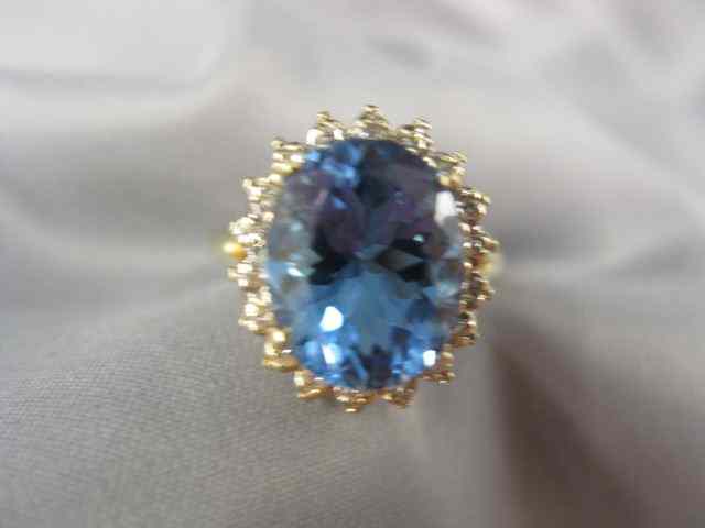 Appraisal: Blue Topaz Diamond Ring carat rich oval gem surrounded by