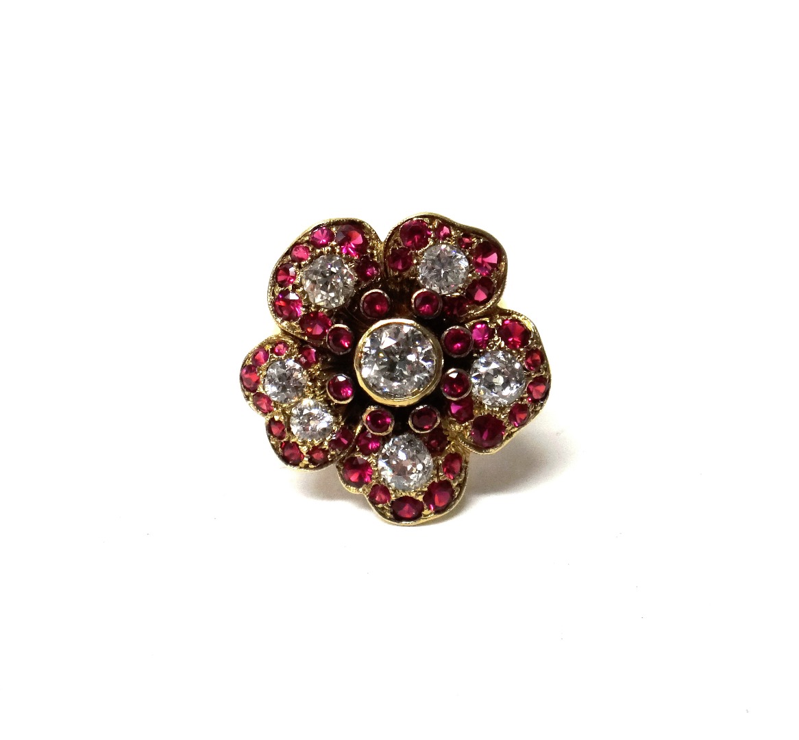 Appraisal: A gold diamond and synthetic ruby ring designed as a