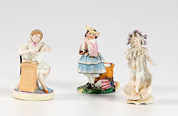 Appraisal: DRESDEN FAIRY FIGURINE AND TWO BISQUE FIGURINES German early th