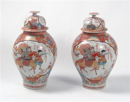 Appraisal: Pair of Kutani porcelain covered jars th century Of urn