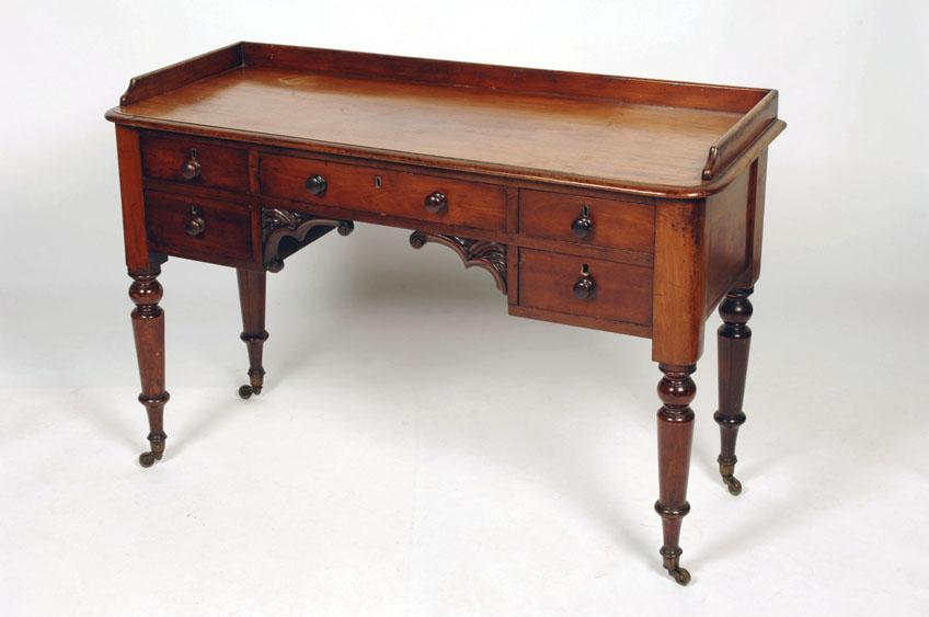 Appraisal: A REGENCY MAHOGANY DRESSING TABLE the rectangular top with rounded