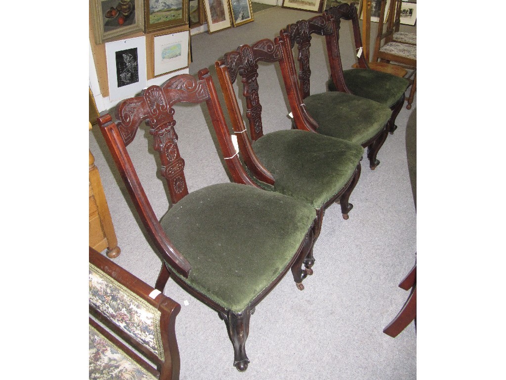 Appraisal: Set of four mahogany dining chairs with carved splats