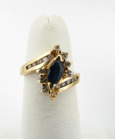 Appraisal: K Yellow gold ring with marquis sapphire center stone with