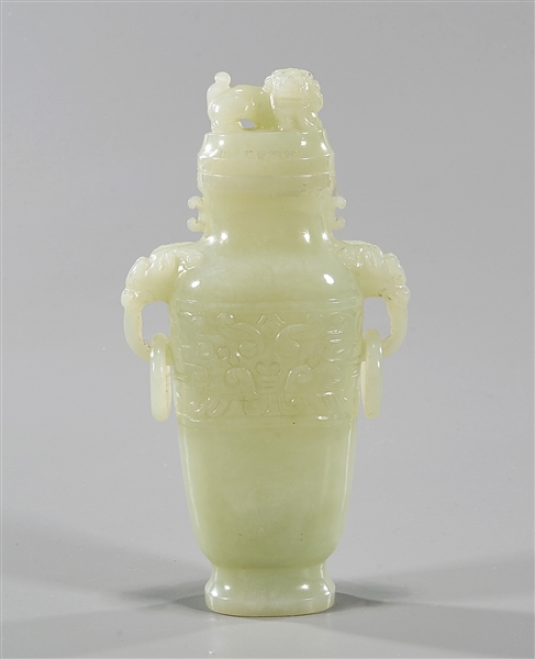 Appraisal: Chinese carved jade covered vase depicting mask face to each