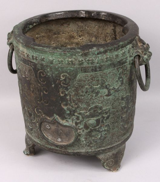 Appraisal: th- th Century Chinese bronze vase having bale handles possibly