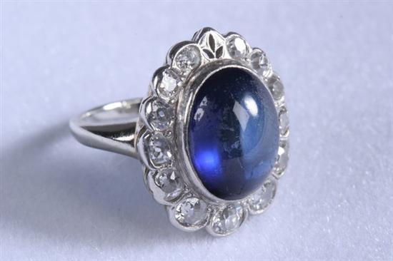 Appraisal: ANTIQUE PLATINUM-ON-GOLD DIAMOND AND SAPPHIRE CABOCHON RING Oval synthetic sapphire