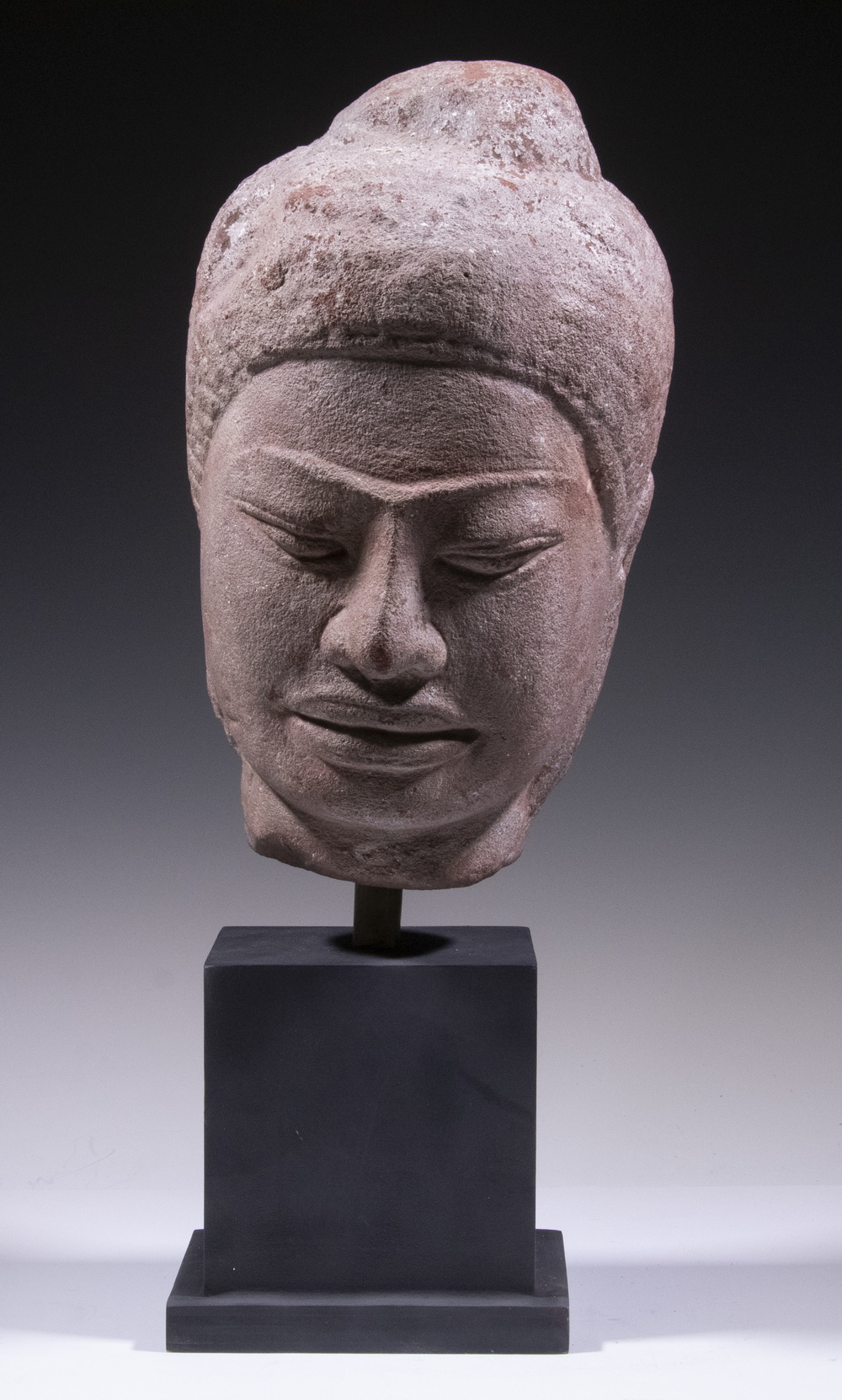 Appraisal: KHMER PERIOD STONE HEAD th c Cambodia red sandstone head