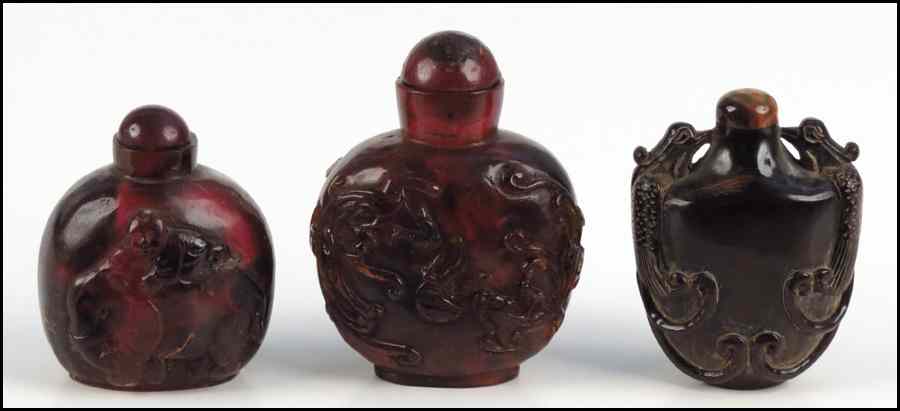 Appraisal: THREE AMBER SNUFF BOTTLES Condition No Specific Condition Recorded -