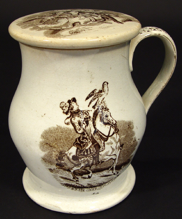 Appraisal: th century pottery tankard and screw top cover printed in