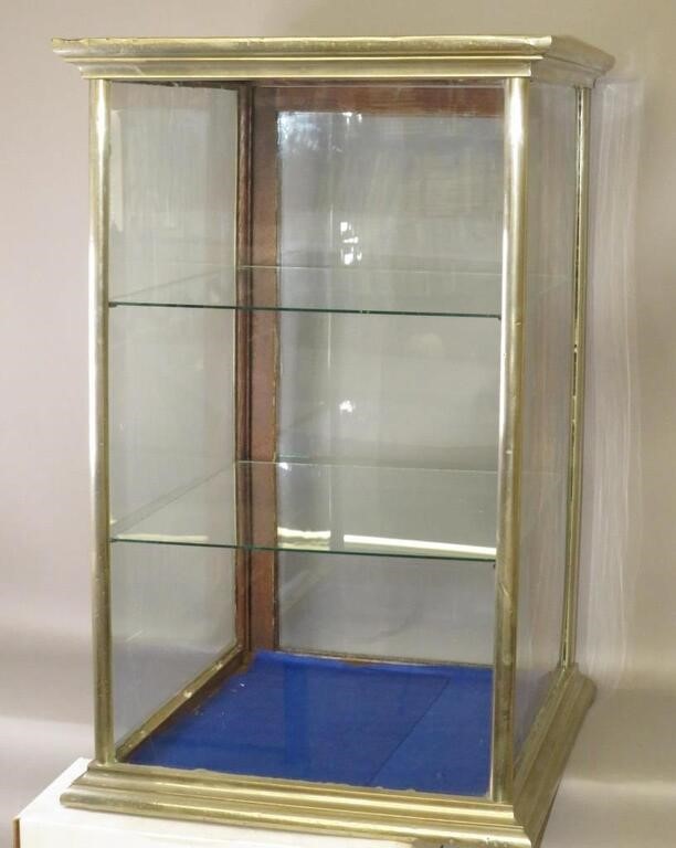 Appraisal: NICKEL PLATED GLASS DISPLAYca square three-tier display cabinet with four