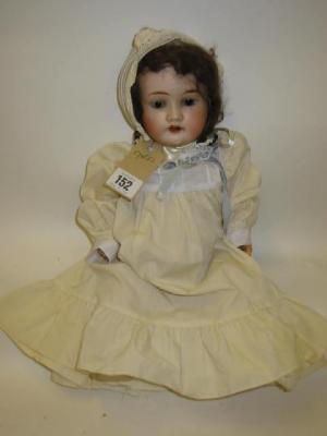 Appraisal: A Theodore Recknagel bisque head doll with dark blue sleeping