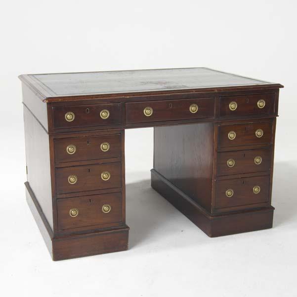 Appraisal: PARTNER S CAMPAIGN DESK In solid mahogany the top fitted