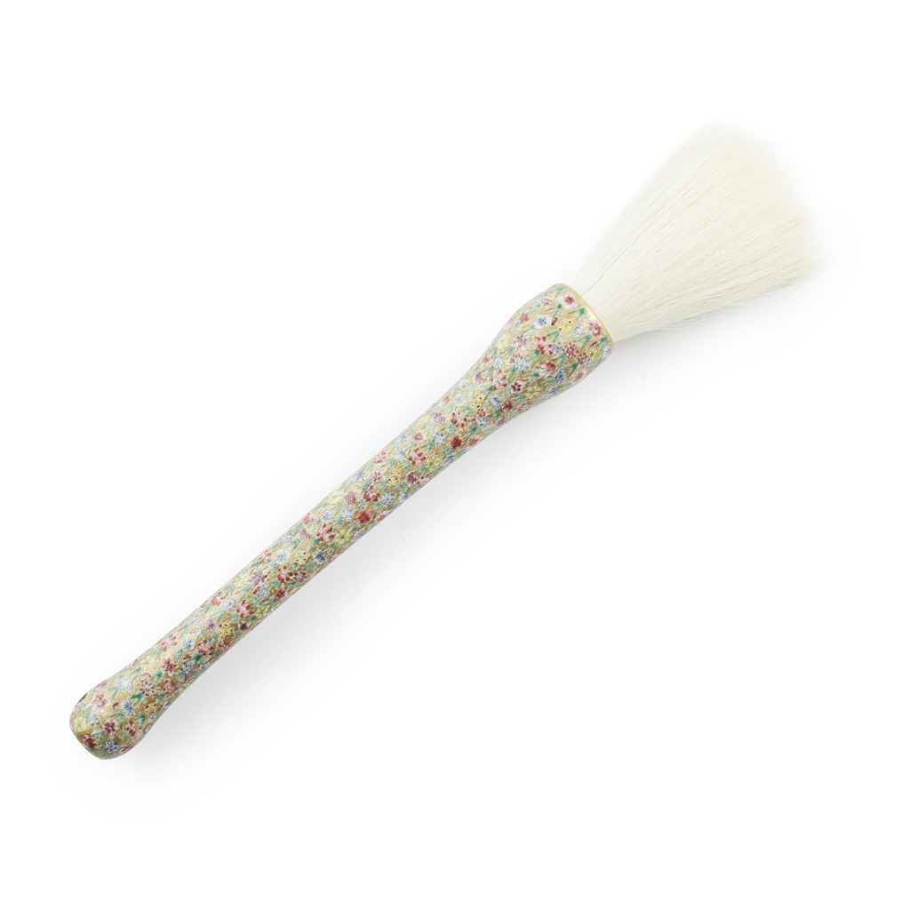 Appraisal: MILLEFLEUR PORCELAIN-HANDLE PAINTING BRUSH the handle painted with overlapping flowers