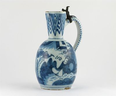 Appraisal: A Delft blue and white ewer painted with two figures