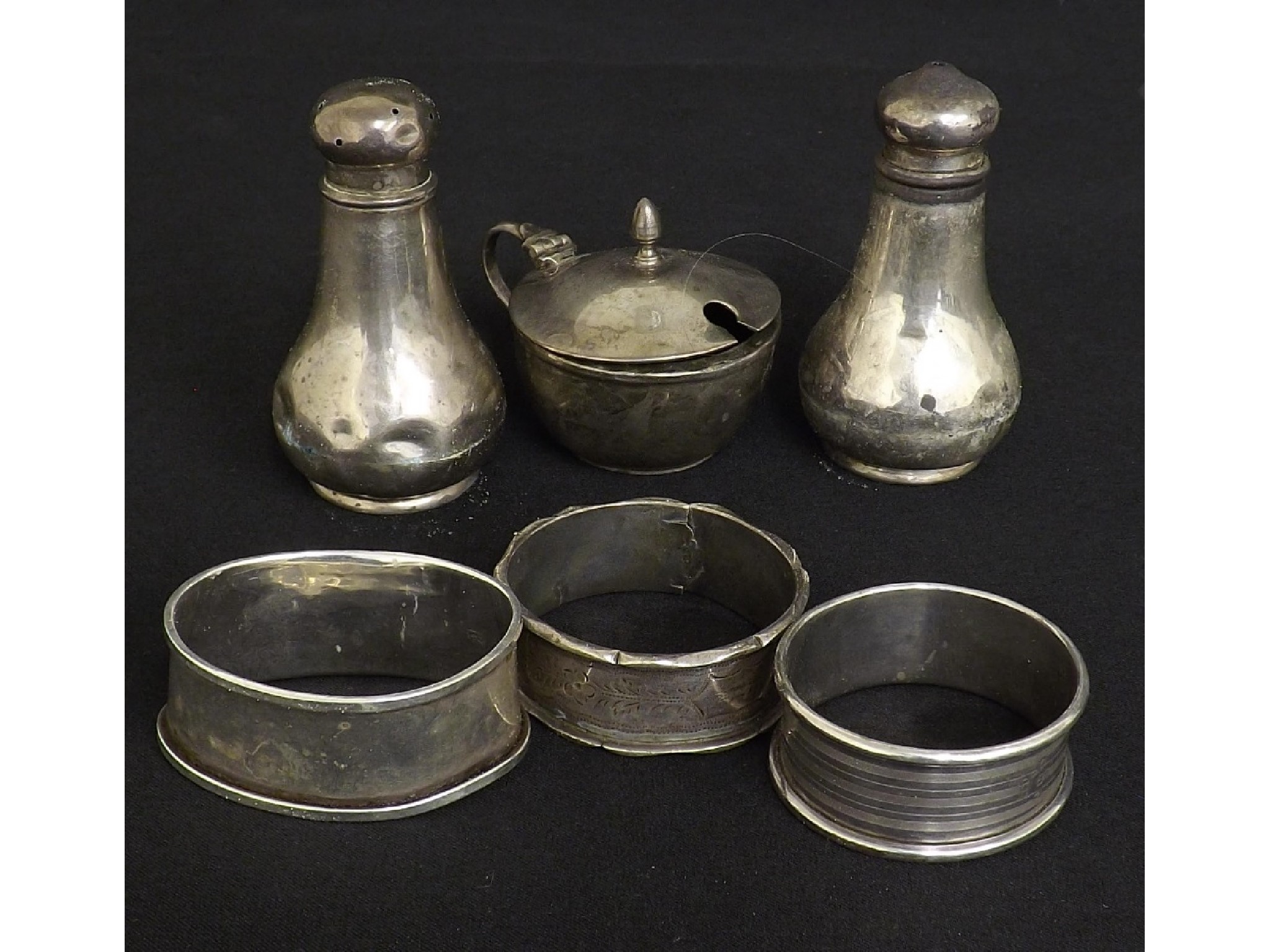 Appraisal: Harlequin three piece silver cruets together with three silver napkin