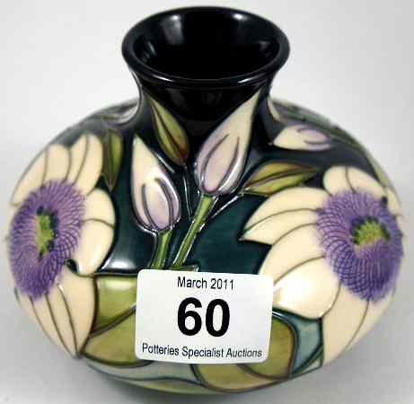 Appraisal: Moorcroft vase decorated with purple green and white flowers height