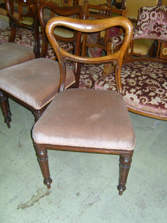 Appraisal: A set of four Victorian rosewood balloon back dining chairs