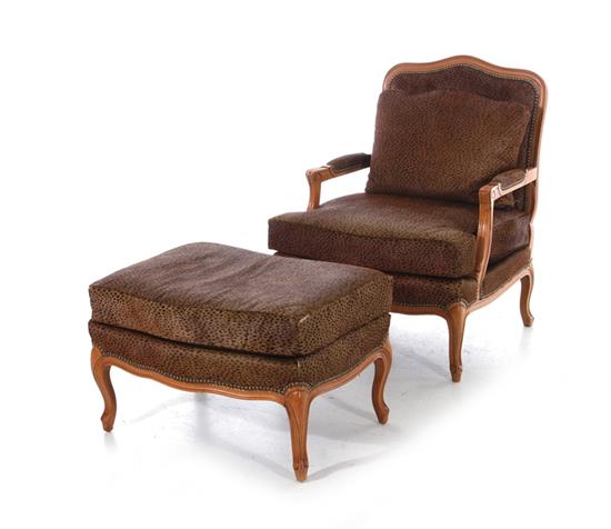 Appraisal: Louis XV style armchair and ottoman faux leopard upholstered BH