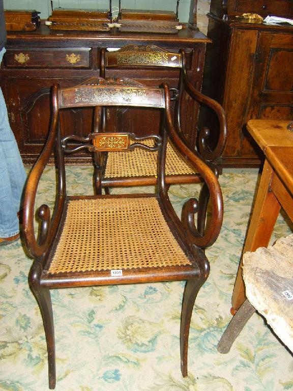 Appraisal: A pair of Regency stained beech wood elbow chairs the