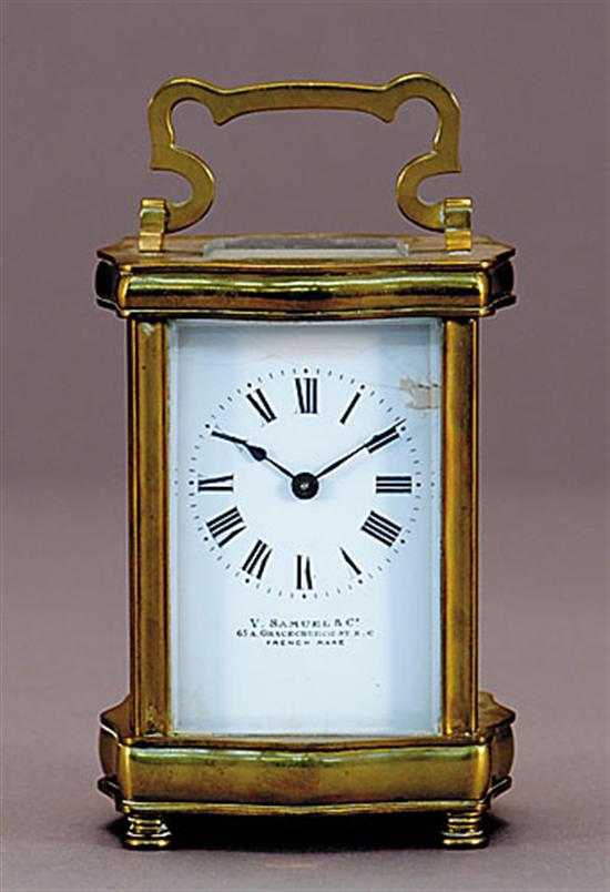 Appraisal: French brass carriage clock shaped hinged handle on upright rectangle-form