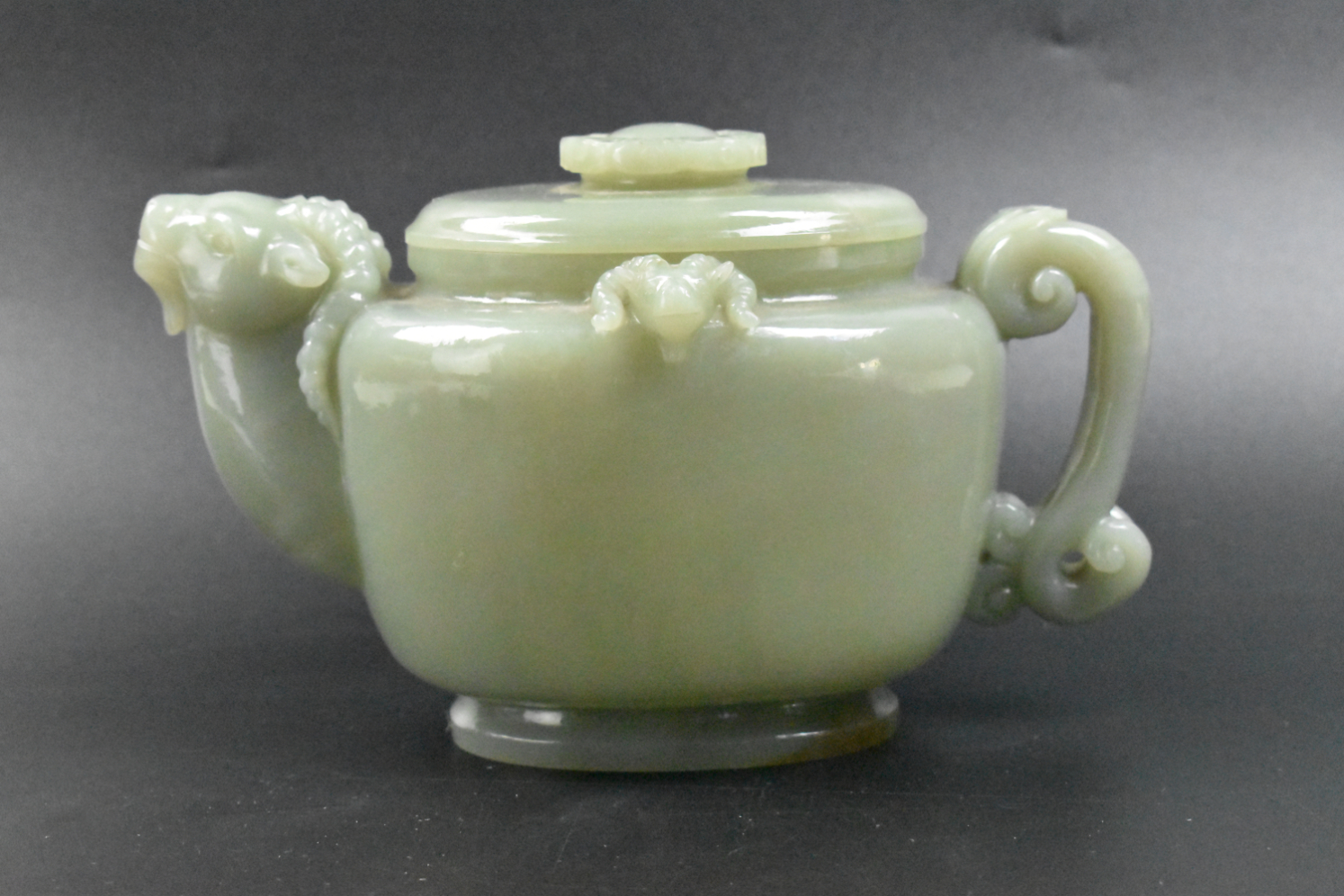 Appraisal: heavily potted Chinese celadon jade wine pot of oval form