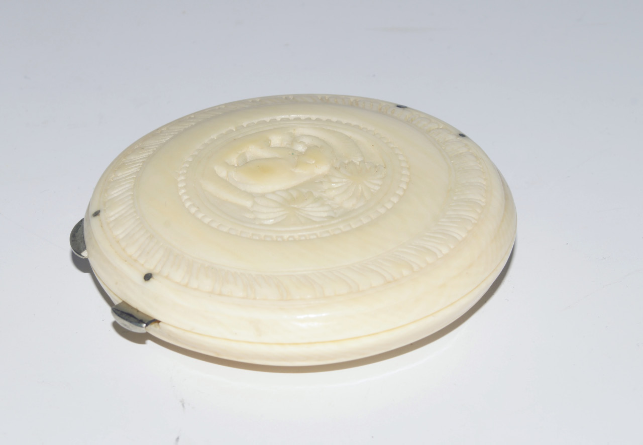 Appraisal: A 's carved ivory powder compact