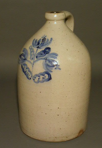 Appraisal: Stoneware jug with blue floral decoration three-gallon h